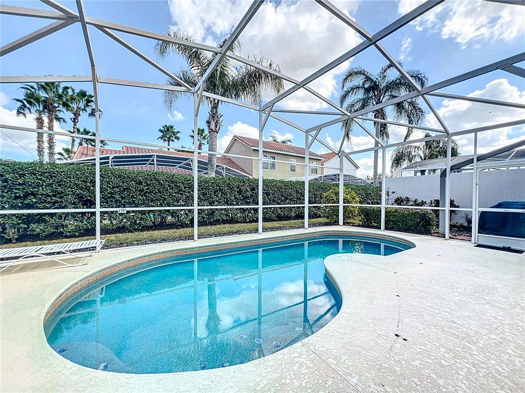 802 Brunello Drive Davenport, FL 33897 - Photo 30 of 36 a view of a swimming pool with a yard