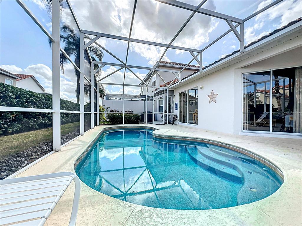 802 Brunello Drive Davenport, FL 33897 - Photo 31 of 36 a view of a swimming pool with a patio