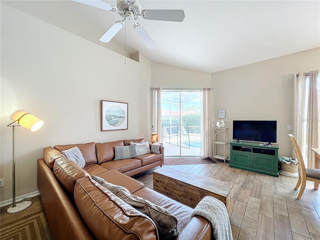 802 Brunello Drive Davenport, FL 33897 - Photo 5 of 36 a living room with furniture and a flat screen tv