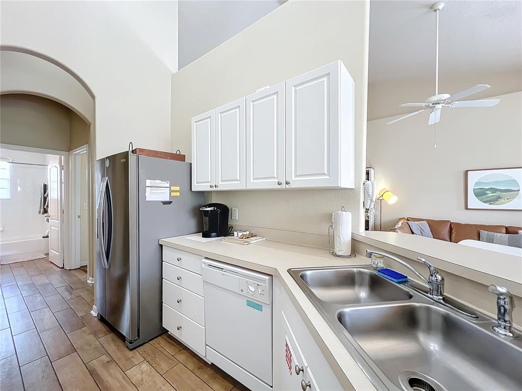 802 Brunello Drive Davenport, FL 33897 - Photo 10 of 36 a kitchen that has a sink cabinets counter space and appliances