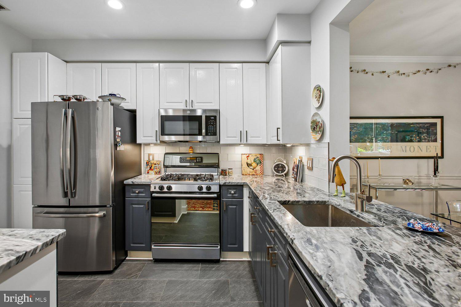 1855 Stratford Park Place, Unit 103 Reston, VA 20190 - Photo 9 of 49 Stainless steel appliances & generous cabinetry.
