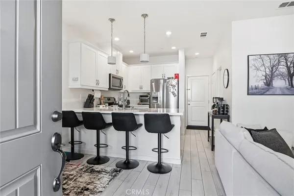 a bed room with furniture and a flat screen tv