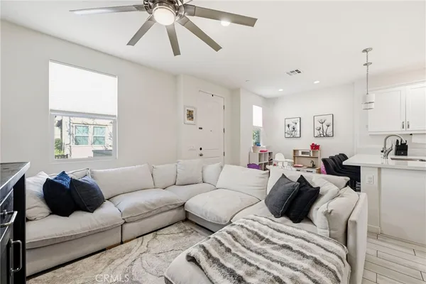 a living room with furniture and a painting