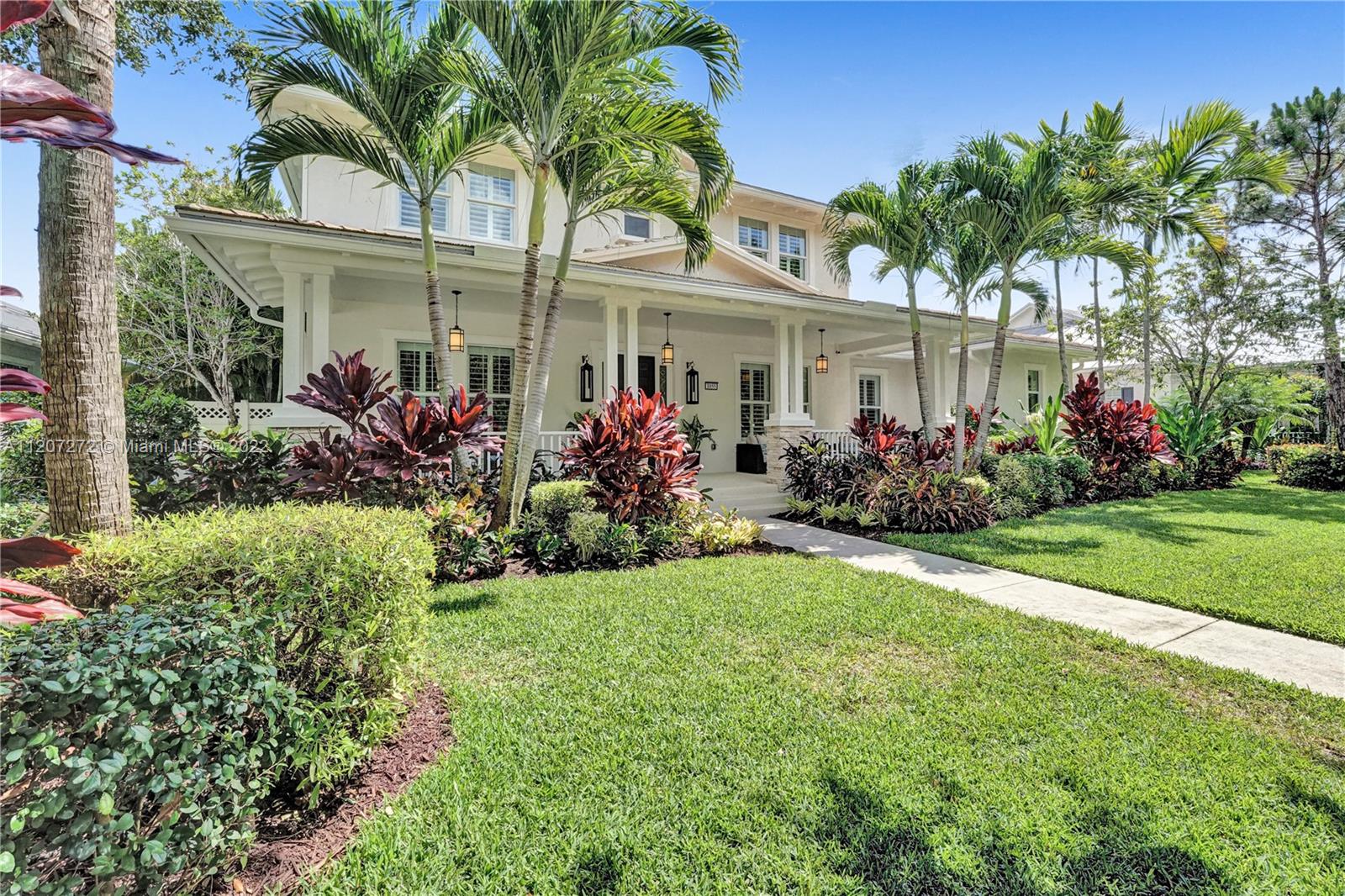 front view of a house with a garden