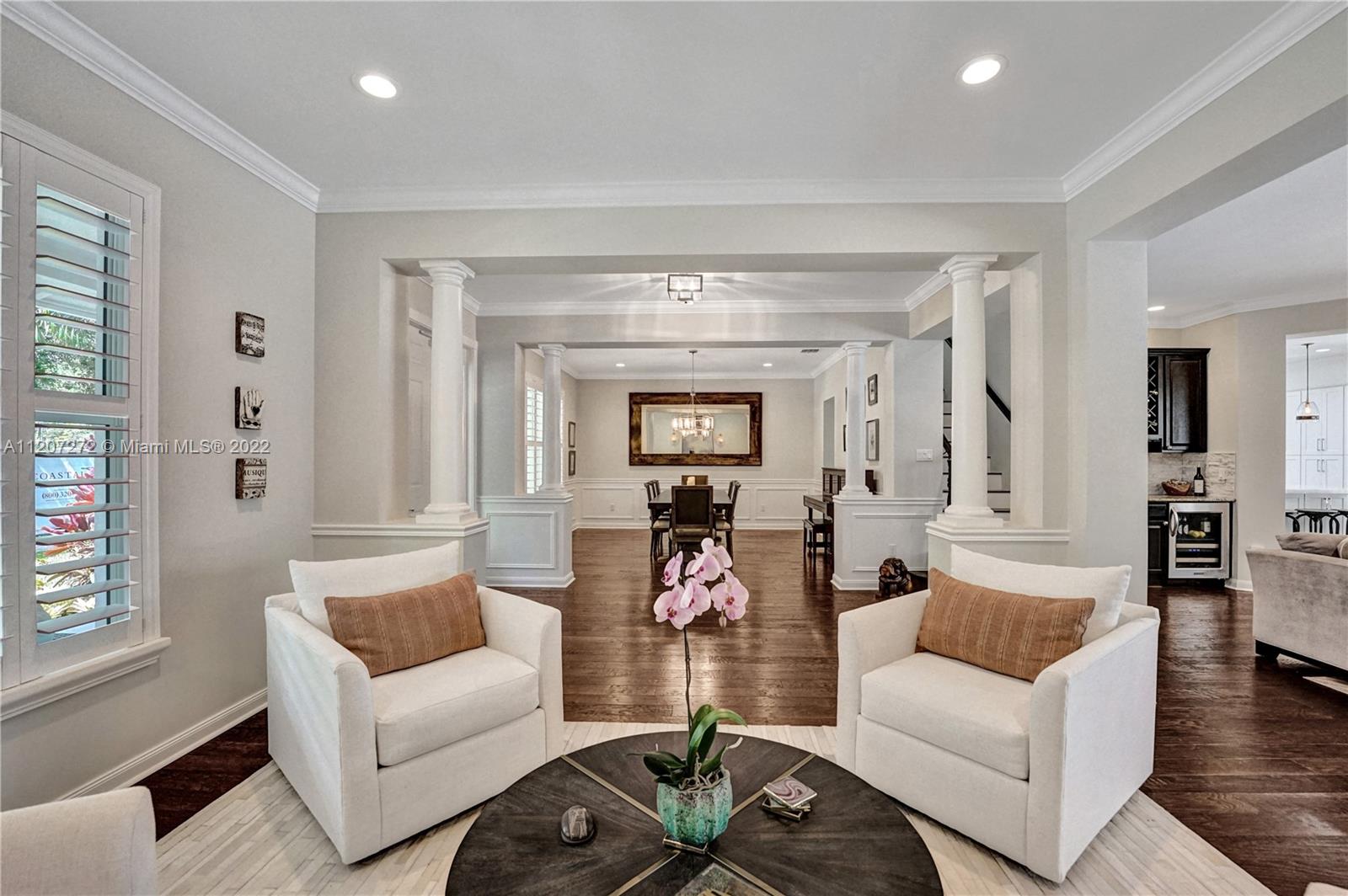 1055 Frederick Small Road Jupiter, FL 33458 - Photo 16 of 48 a living room with furniture and a large window