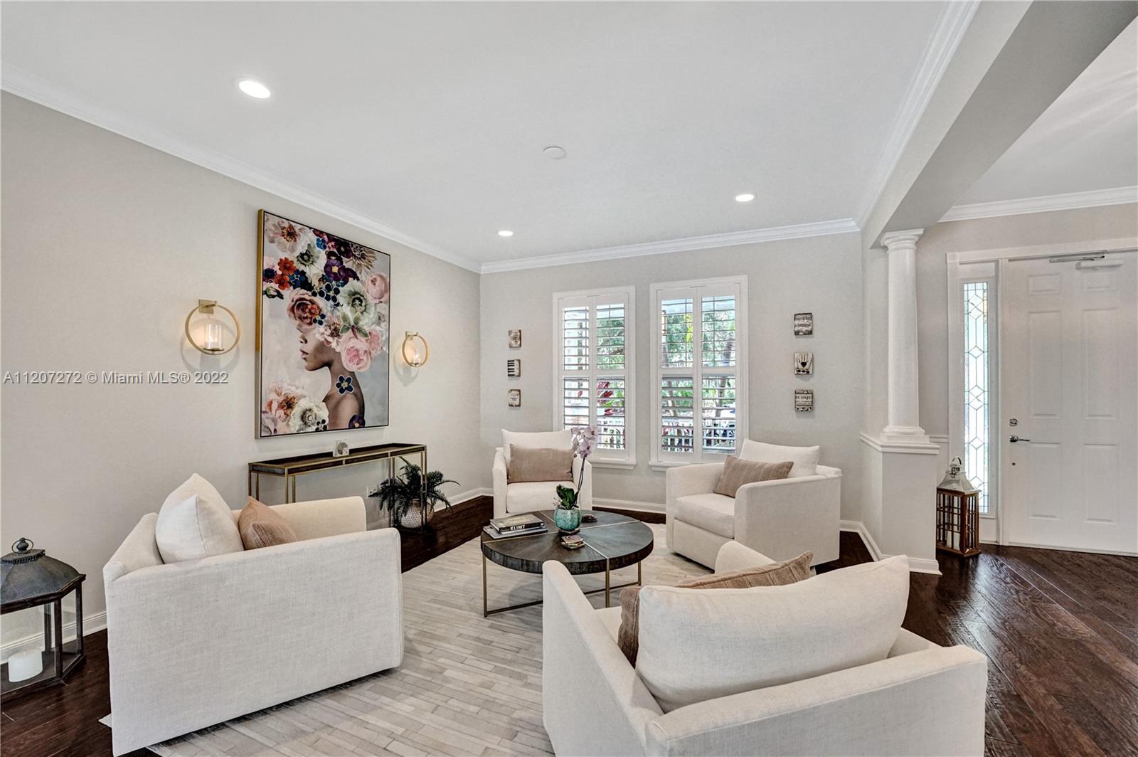 1055 Frederick Small Road Jupiter, FL 33458 - Photo 17 of 48 a living room with furniture and a large window