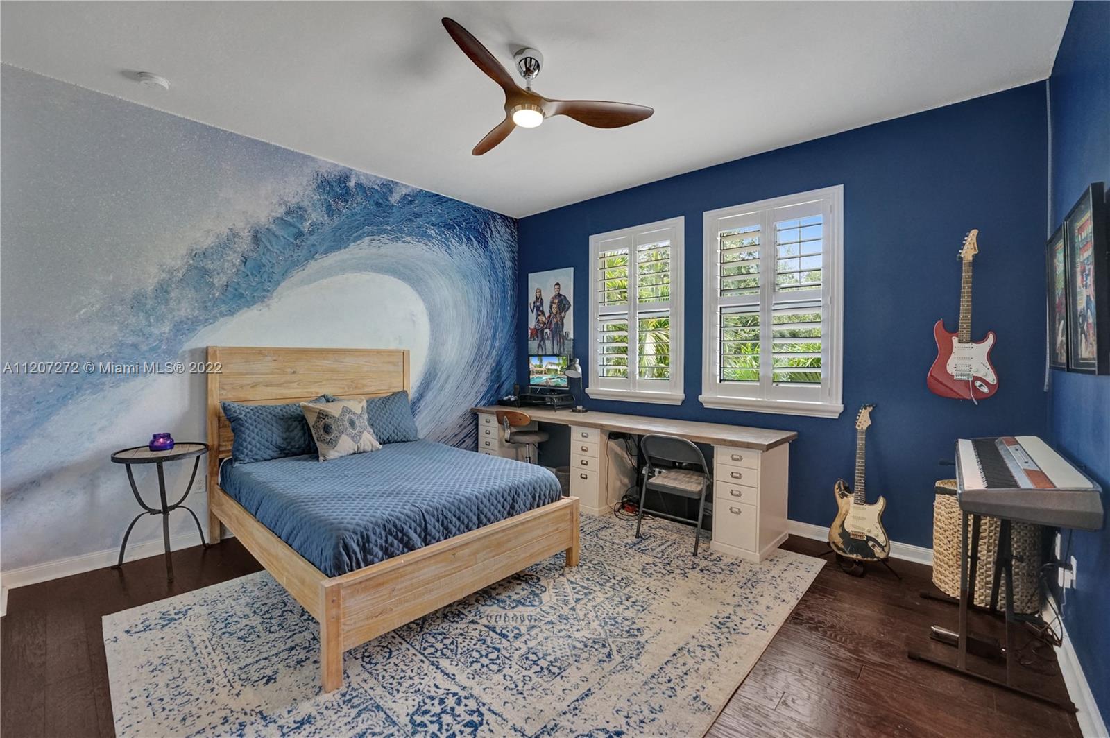 1055 Frederick Small Road Jupiter, FL 33458 - Photo 32 of 48 a bedroom with a bed a table and a large window