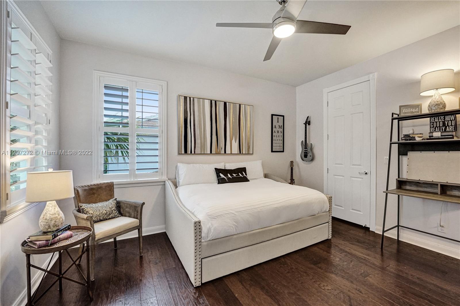 1055 Frederick Small Road Jupiter, FL 33458 - Photo 33 of 48 a bedroom with a bed wooden floor and furniture