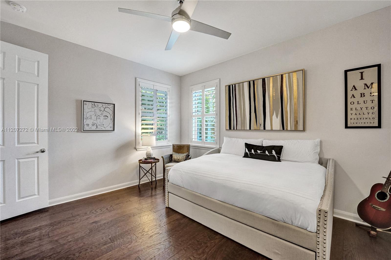 1055 Frederick Small Road Jupiter, FL 33458 - Photo 34 of 48 a bedroom with a bed wall painting and a window