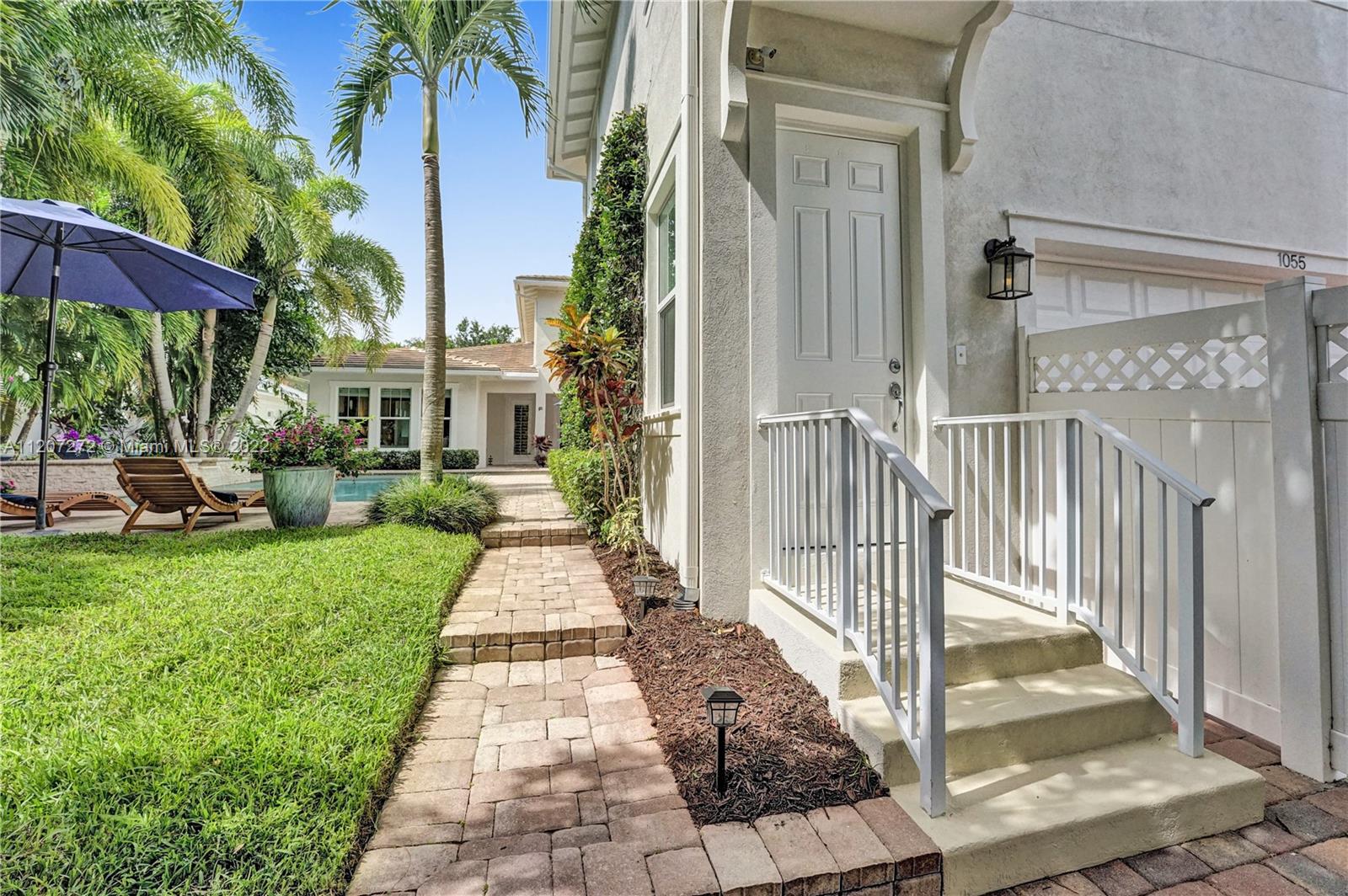 1055 Frederick Small Road Jupiter, FL 33458 - Photo 39 of 48 a view of a house with a yard