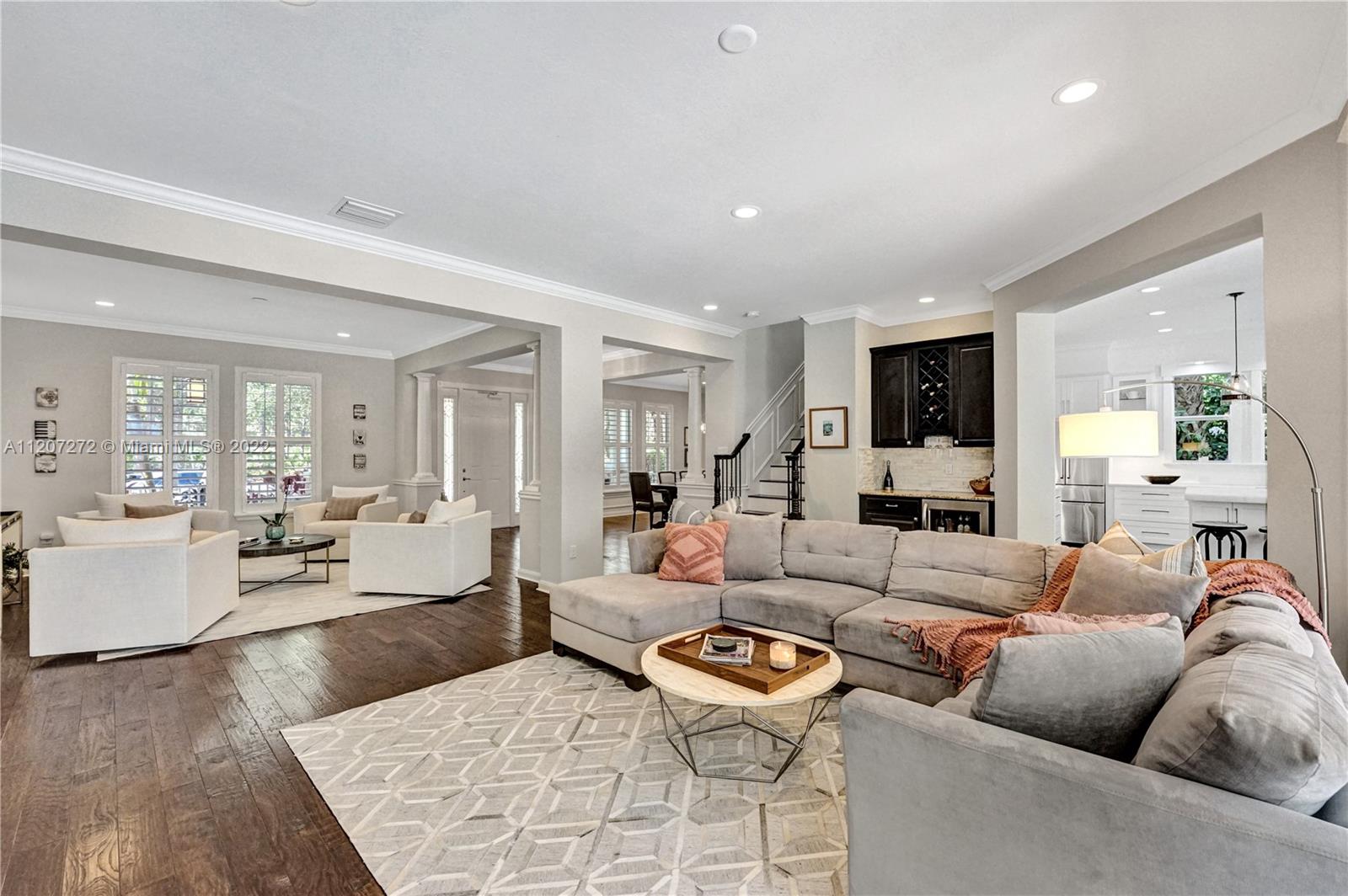 1055 Frederick Small Road Jupiter, FL 33458 - Photo 10 of 48 a living room with furniture kitchen view and a large window