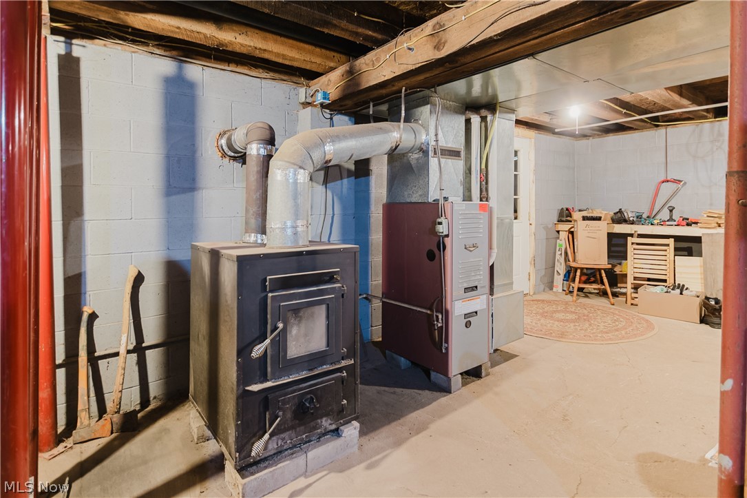47480 Unionvale Road Cadiz, OH 43907 - Photo 35 of 37 View of basement area featuring woodburner