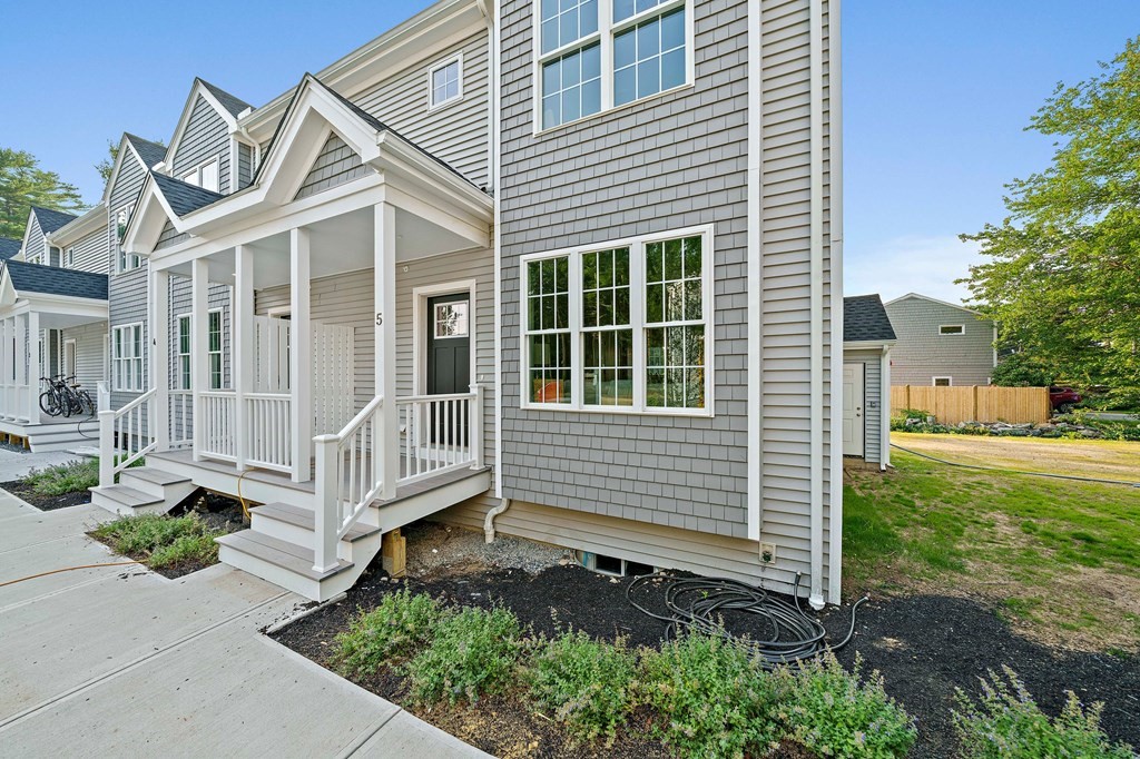 30 Old Washington Street, Unit 9 Pembroke, MA 02359 - Photo 1 of 21 a view of a house with a yard