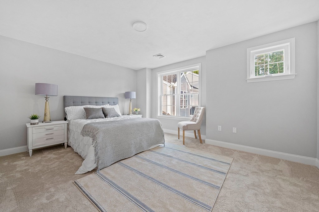 30 Old Washington Street, Unit 9 Pembroke, MA 02359 - Photo 13 of 21 a bedroom with a bed and a couch
