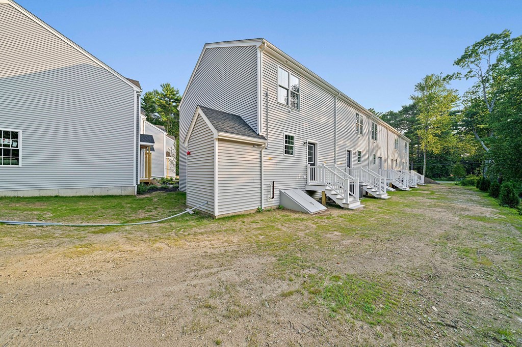 30 Old Washington Street, Unit 9 Pembroke, MA 02359 - Photo 20 of 21 a view of a house with backyard and garden