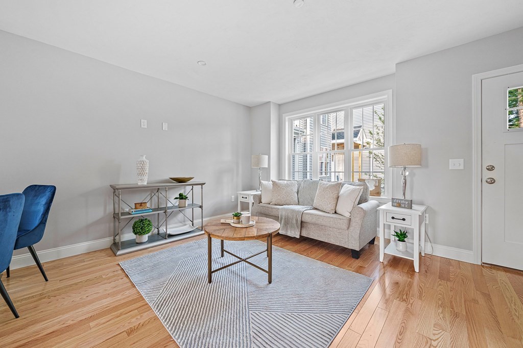 30 Old Washington Street, Unit 9 Pembroke, MA 02359 - Photo 3 of 21 a living room with furniture and a wooden floor