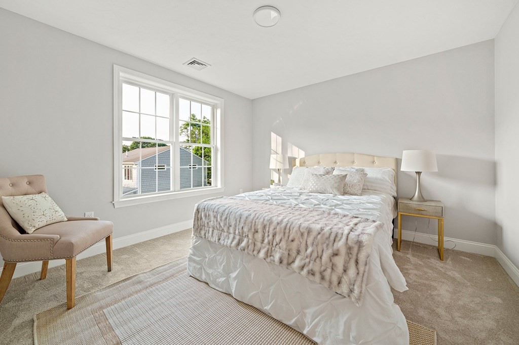 30 Old Washington Street, Unit 9 Pembroke, MA 02359 - Photo 10 of 21 a spacious bedroom with a bed and a window