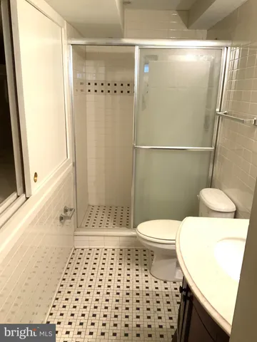 a view of a building with backyard outdoor seating and hardwood