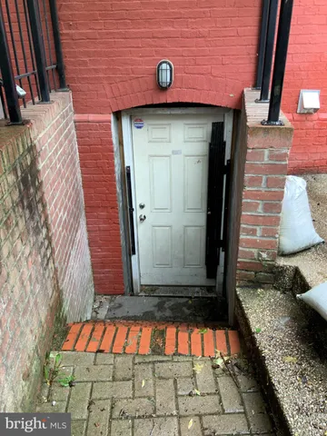 a view of a brick house with a street
