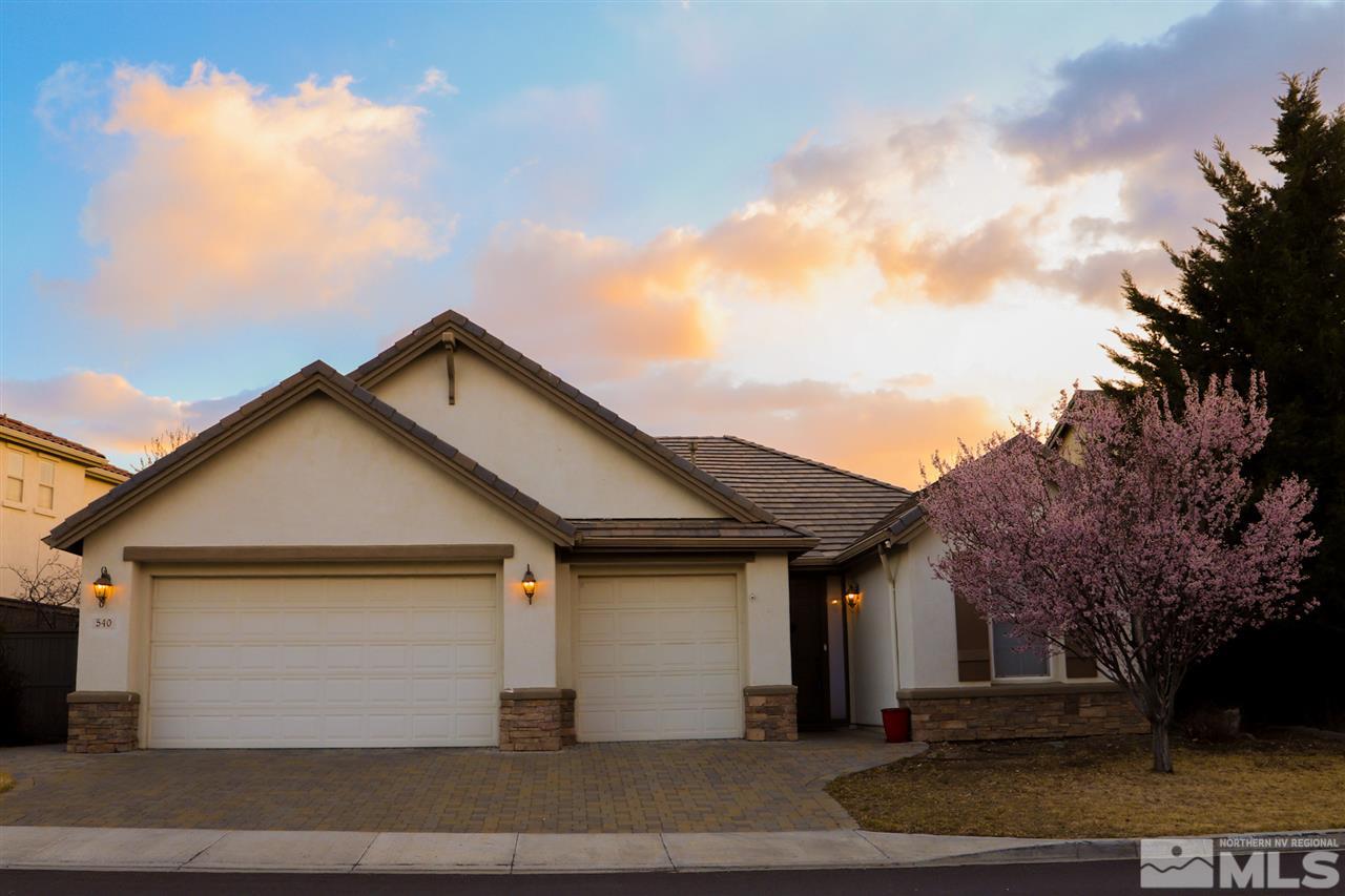 a front view of a house with garage