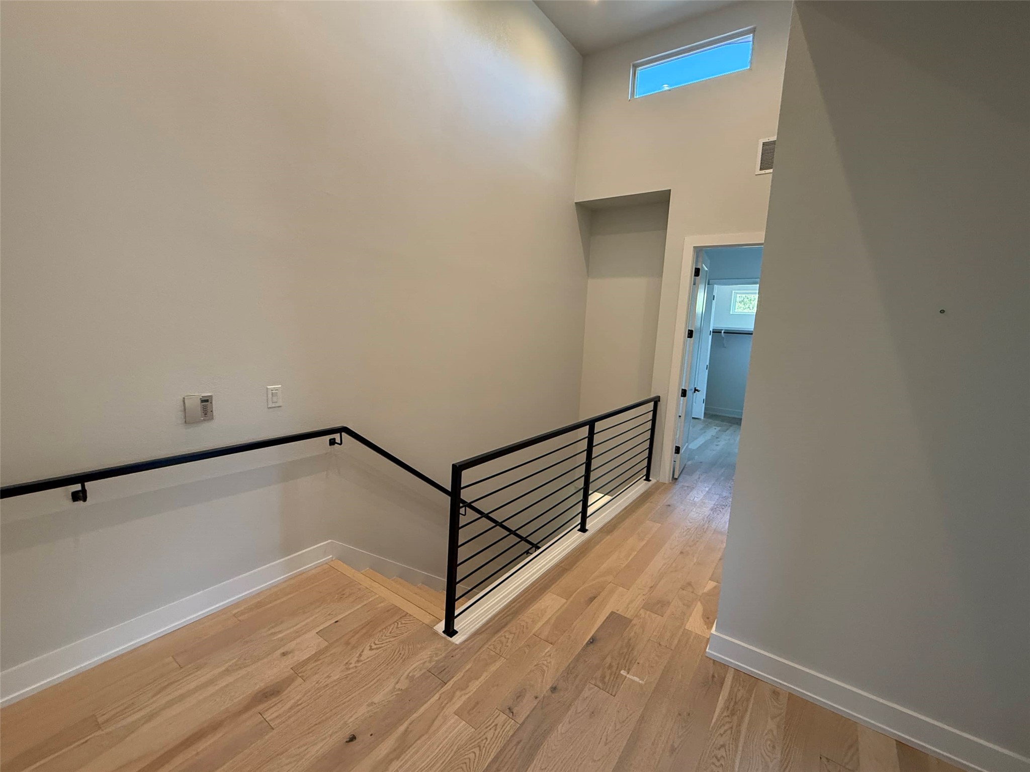 3509 Oak Springs Drive, Unit A Austin, TX 78721 - Photo 15 of 16 a view of a hallway with wooden floor