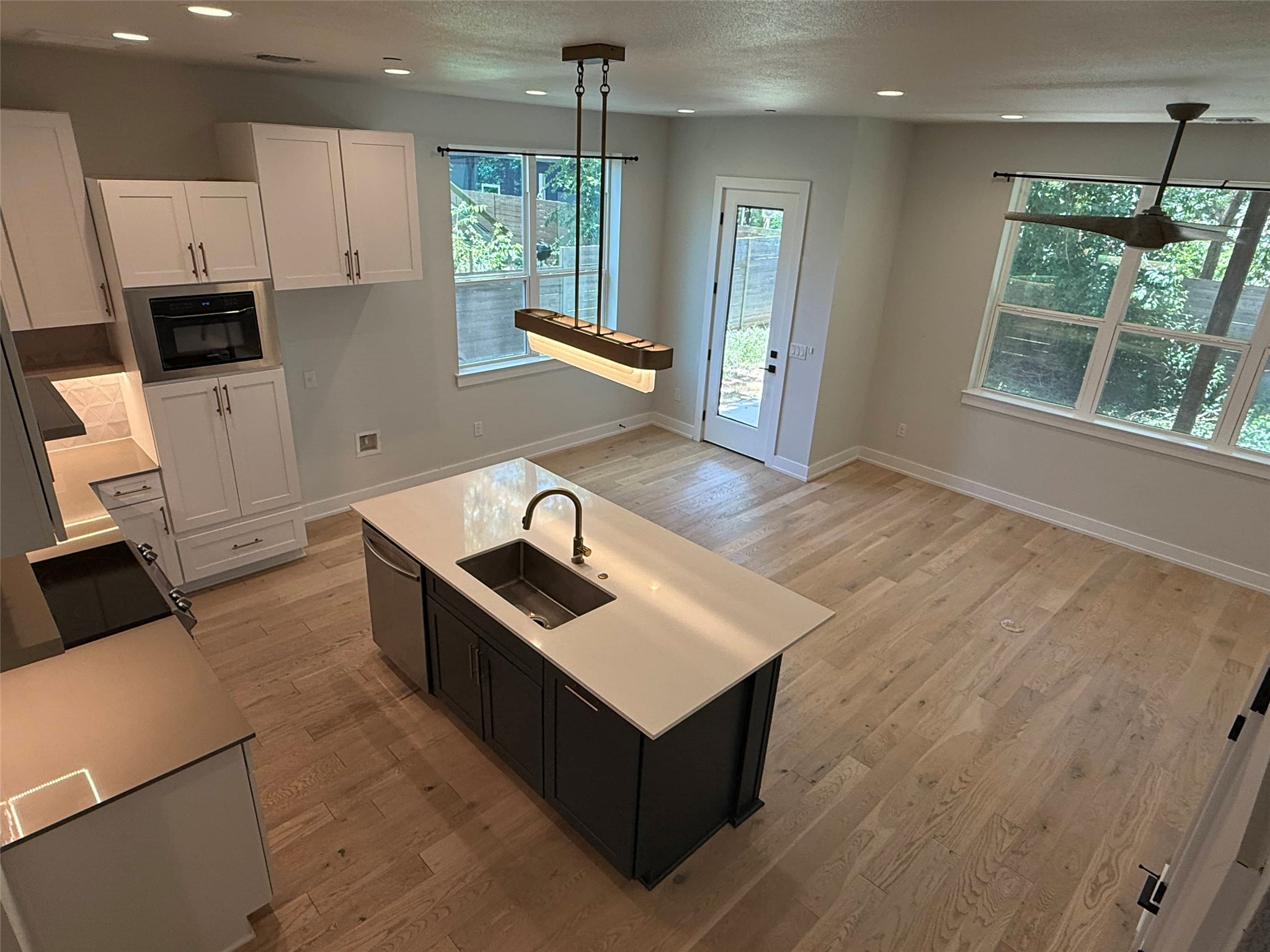 3509 Oak Springs Drive, Unit A Austin, TX 78721 - Photo 5 of 16 a kitchen with stainless steel appliances granite countertop a sink a stove and a refrigerator