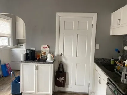 a kitchen with a sink and cabinets