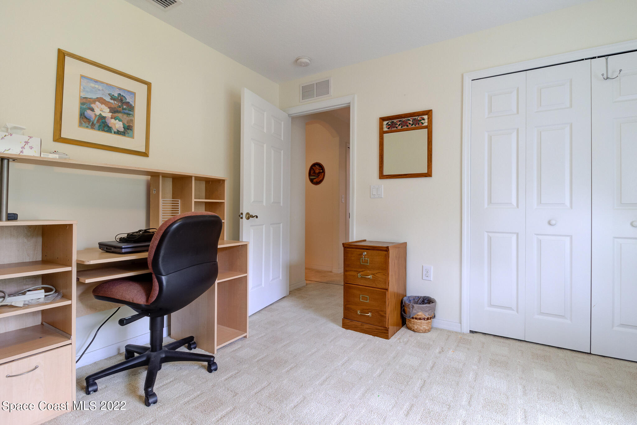 1920 Benjamin Road Malabar, FL 32950 - Photo 14 of 26 a view of a workspace with furniture and gym equipment