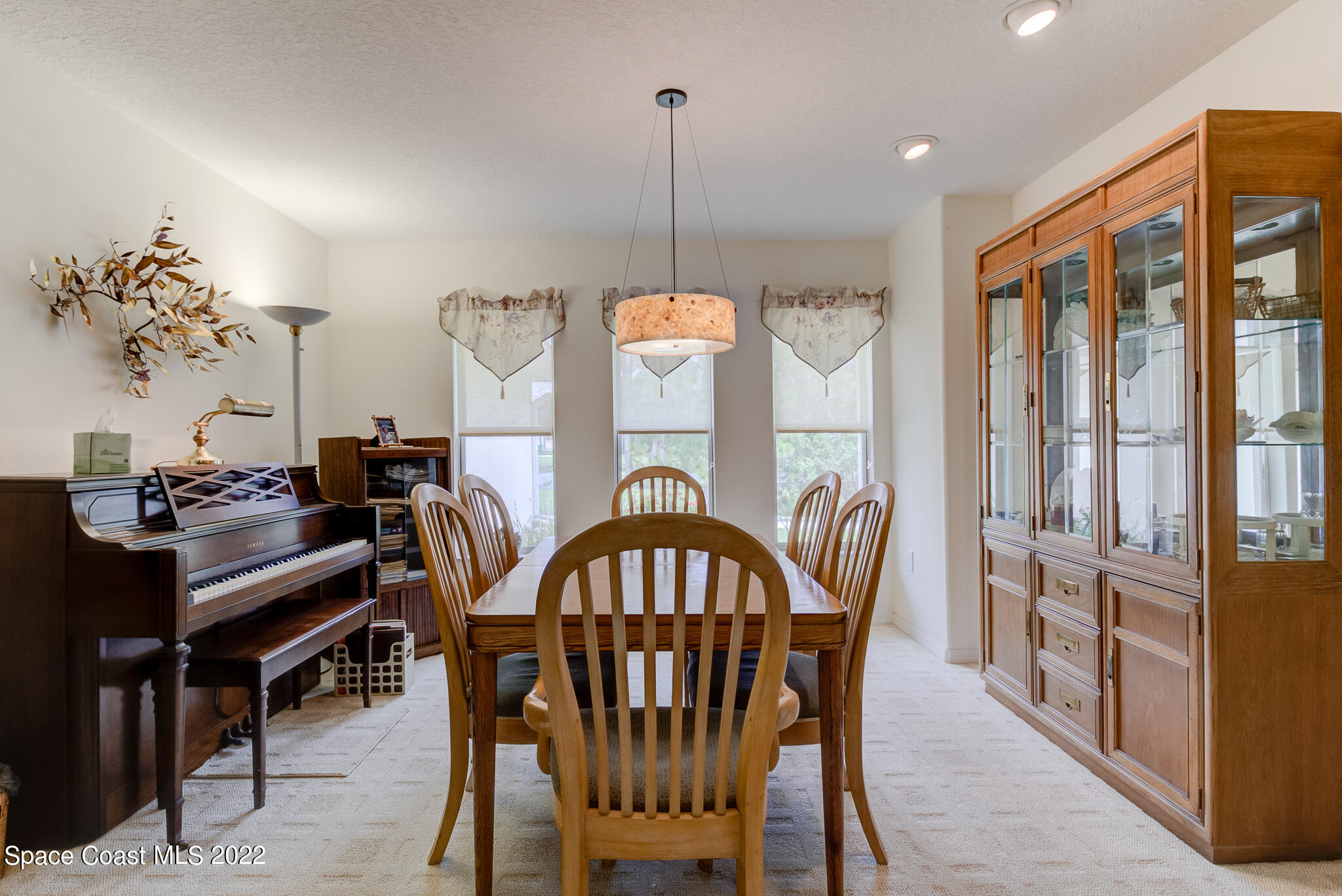 1920 Benjamin Road Malabar, FL 32950 - Photo 7 of 26 a view of a dining room with furniture window and wooden floor