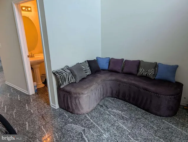 a living room with a couch and a window