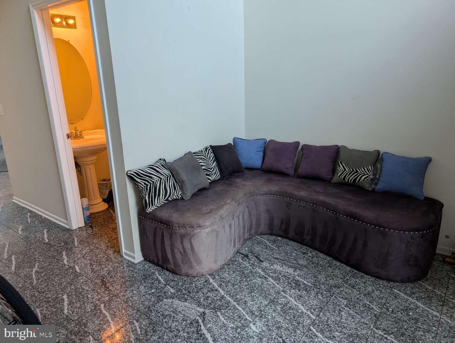 9 Jimarie Court Hamilton, NJ 08620 - Photo 2 of 20 a living room with a couch and a window