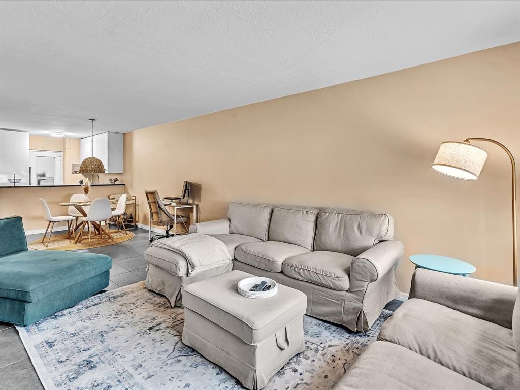 2555 Northeast 11th Street, Unit 610 Fort Lauderdale, FL 33304 - Photo 1 of 33 a living room with furniture and a couch