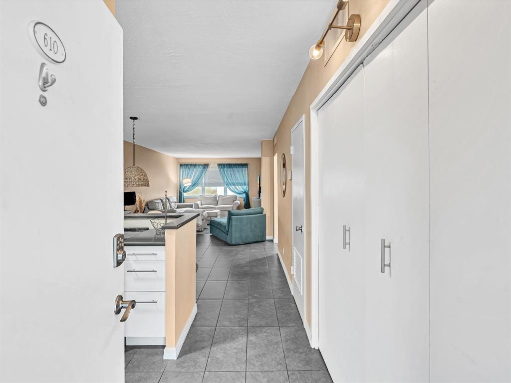 2555 Northeast 11th Street, Unit 610 Fort Lauderdale, FL 33304 - Photo 16 of 33 a view of a kitchen from the hallway