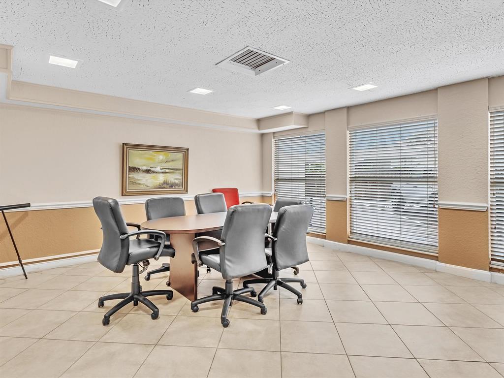 2555 Northeast 11th Street, Unit 610 Fort Lauderdale, FL 33304 - Photo 26 of 33 a view of a dining room with furniture and a window