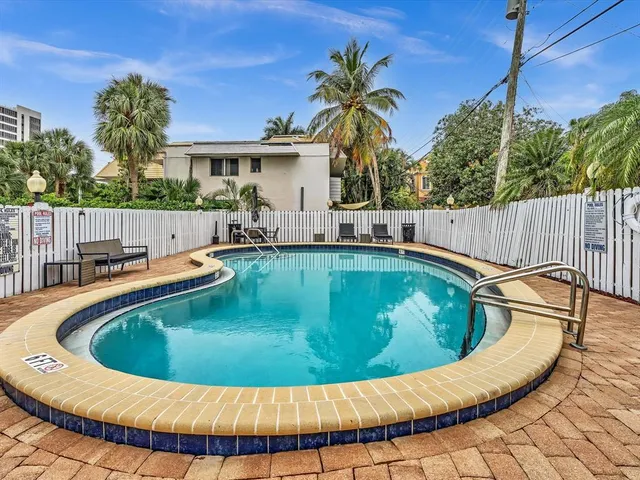 a view of a swimming pool with a patio
