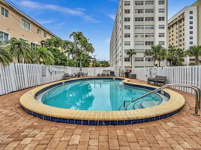 a view of a swimming pool with a balcony