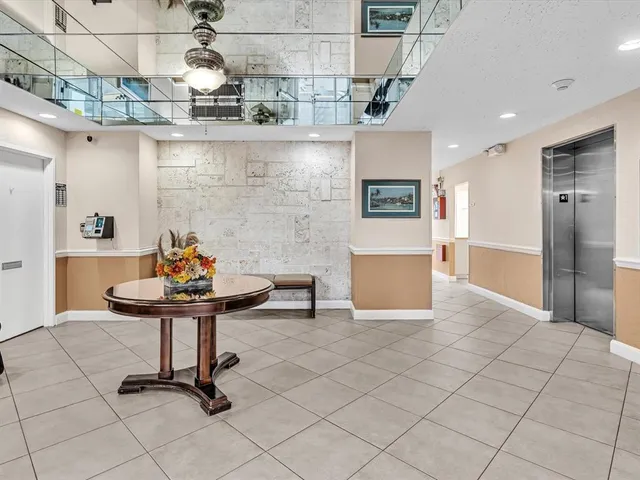 a view of a kitchen with a sink and a refrigerator