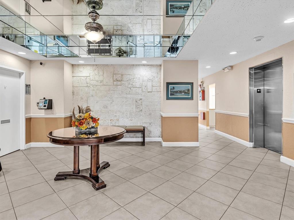 2555 Northeast 11th Street, Unit 610 Fort Lauderdale, FL 33304 - Photo 31 of 33 a view of a kitchen with a sink and a refrigerator