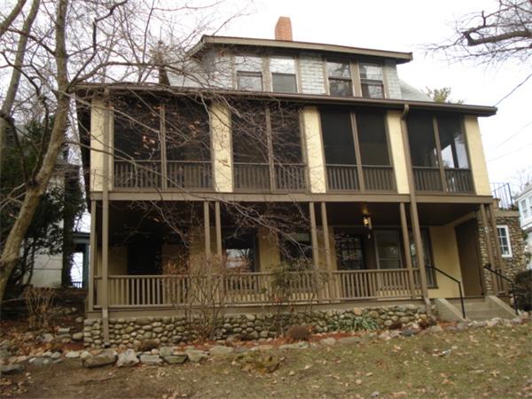 4 Lake Road Wellesley, MA 02482 - Photo 2 of 20 a view of a large building with a large window