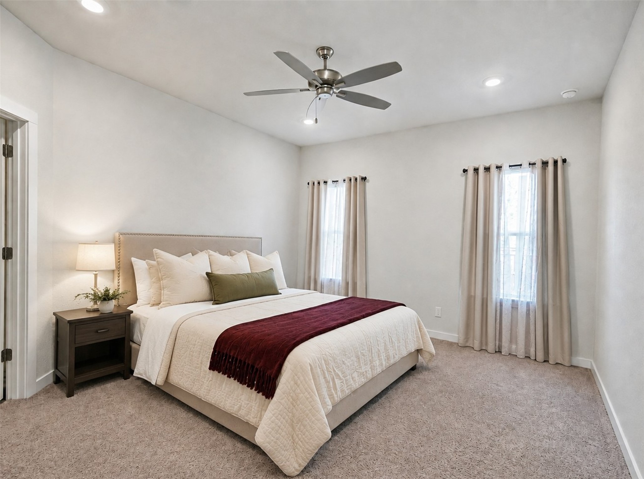 1924 Split Rock Road New Braunfels, TX 78130 - Photo 7 of 20 Soft carpeting pairs with recessed lighting to create a serene, restful atmosphere.