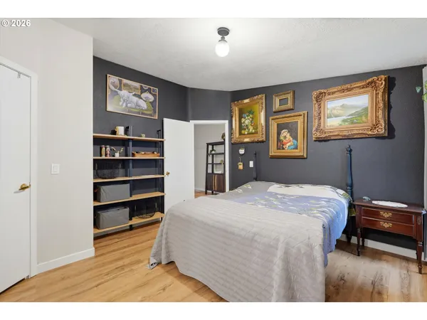 a bedroom with a bed and a bookshelf