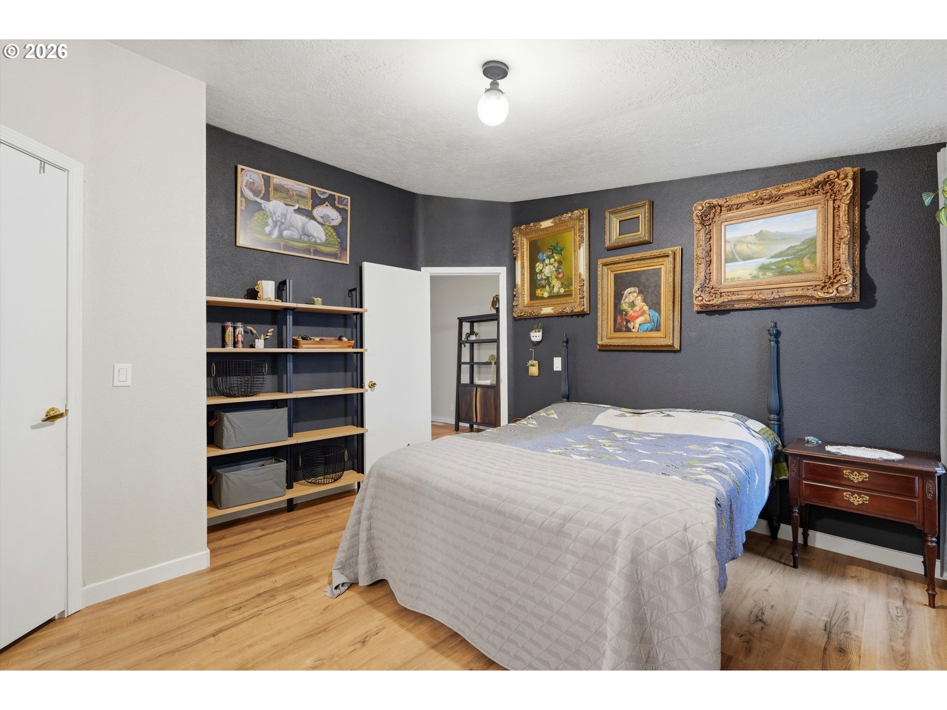 39000 Northwest Shermans Mill Road Banks, OR 97106 - Photo 15 of 38 a bedroom with a bed and a bookshelf