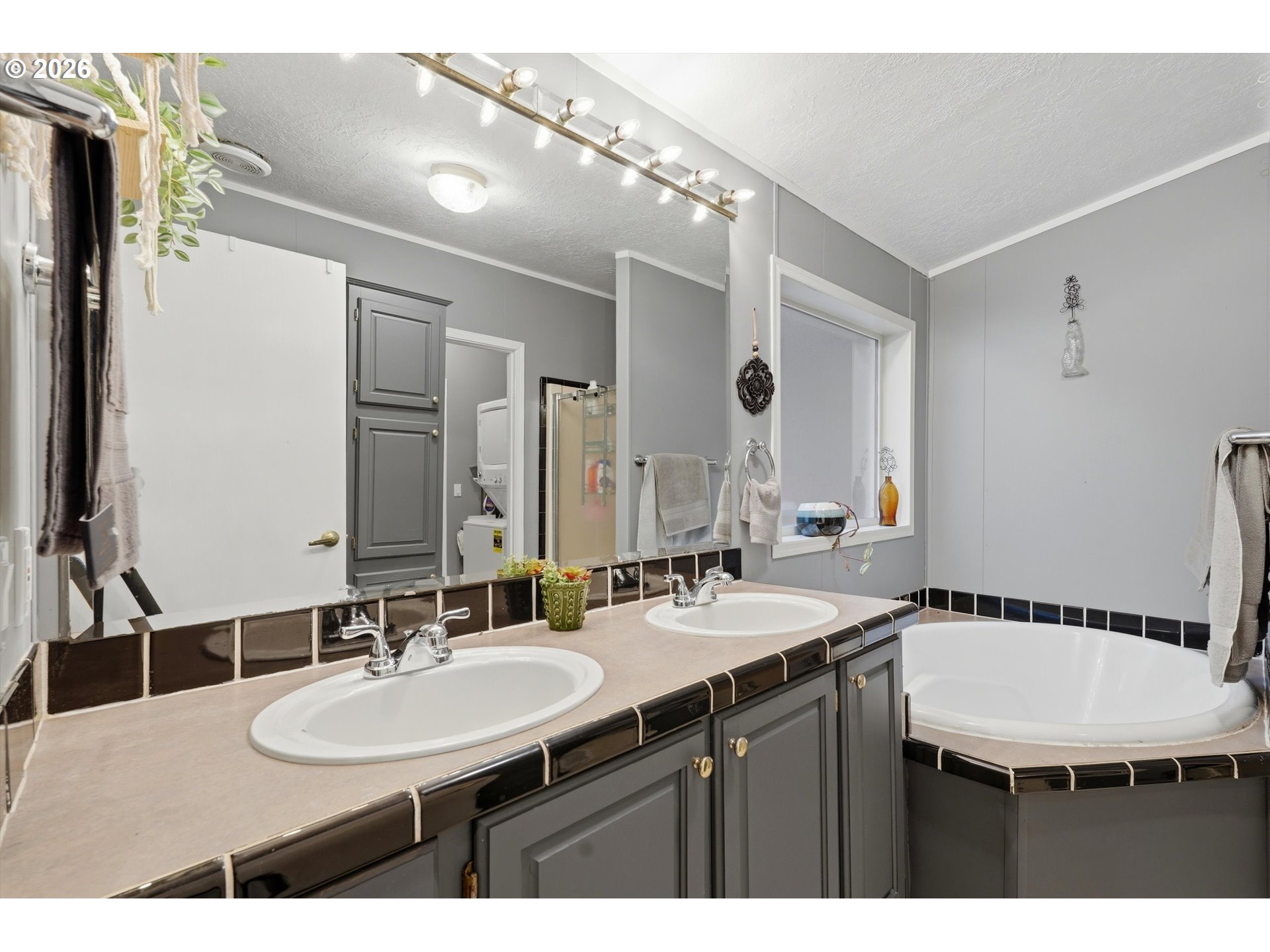 39000 Northwest Shermans Mill Road Banks, OR 97106 - Photo 17 of 38 a bathroom with a sink double vanity and a mirror