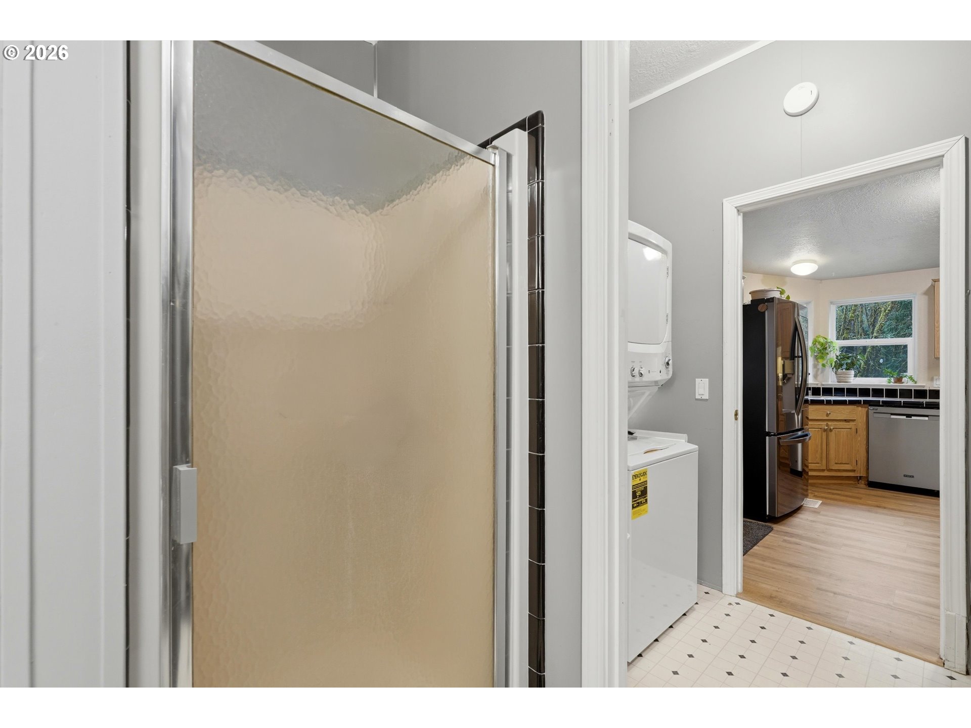 39000 Northwest Shermans Mill Road Banks, OR 97106 - Photo 18 of 38 a view of a bathroom with a tub shower a mirror and a sink