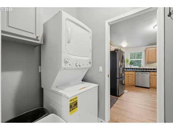 a kitchen with a refrigerator and a sink