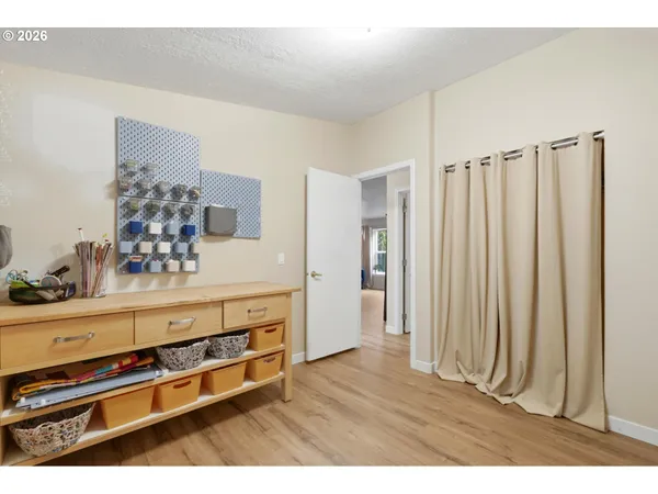 a view of kitchen with cabinets and wooden floor
