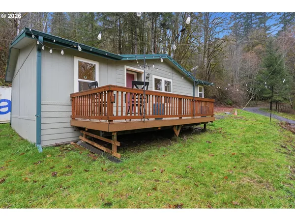 a view of a backyard with a small cabin
