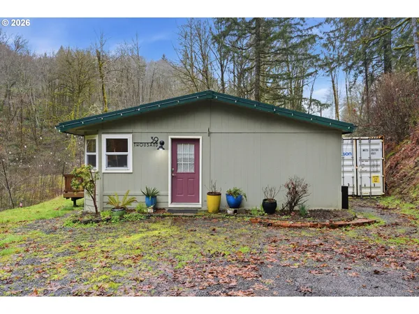 a backyard of a house with a yard and garage