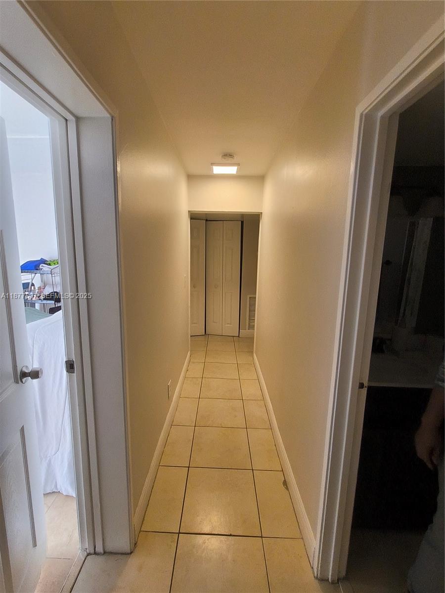 7809 Northwest 67th Avenue, Unit 7809 Tamarac, FL 33321 - Photo 8 of 13 a bathroom with a sink and a mirror