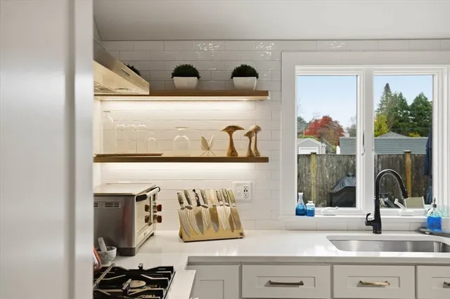 a kitchen with a sink and a window